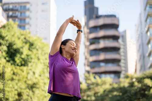 Картината върху платно Woman, stretching and smiling in city with fitness, back stretch or wellness outdoor
