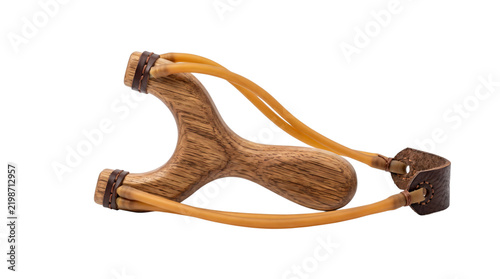 Wooden slingshot with rubber bands and leather pouch. Classic handmade toy isolated on white background