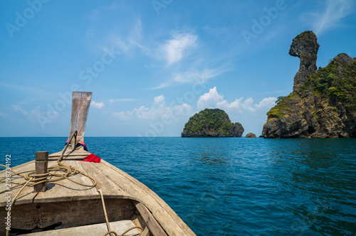 chicken island or koh khai at krabi amazing in thailand with old traditional head wooden long tail boat or tourist and fishing boat in deep blue sea and sky or ocean marine for travel holiday vacation