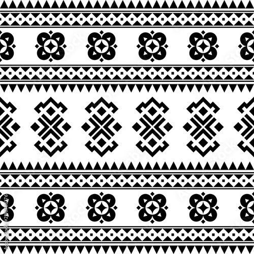 Geometric seamless ethnic pattern design in black white monochrome color for template background design vector