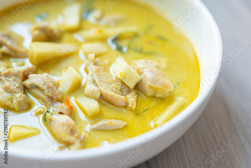 Fotografía Chicken soup with potato and turmeric broth served in white bowl