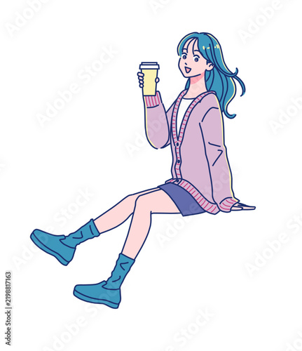 腰掛けるカジュアルファッションの若い女性