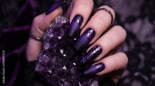 Dark moody gothic nail art with purple chrome foil and amethyst crystal