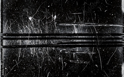 Old scratched film negative texture overlay with heavy dust particles and harsh scratches for vintage design effects