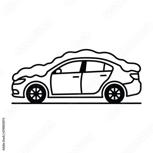 Car covered in snow driving on road in winter weather conditions