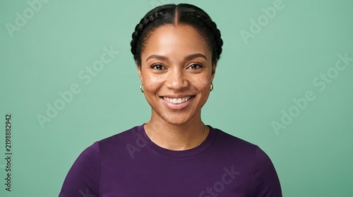 Bright, cheerful professional portrait of a smiling young Black woman with braided hair, perfect for marketing, web design, corporate profiles, or social media backdrops.