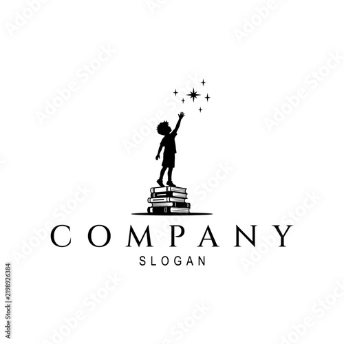 Boy Standing on Stack of Books Reaching Star Logo