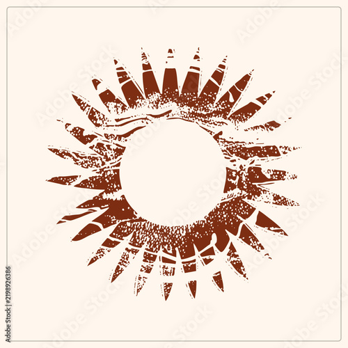 Hand carved sunburst emblem, or sun wheel, in rough linocut stencil style. Earthy terracotta texture lends this folk solar vintage block print charm with speckled rays.