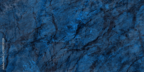 Deep blue stone texture with dark gray veins, rough natural rock surface pattern, textured