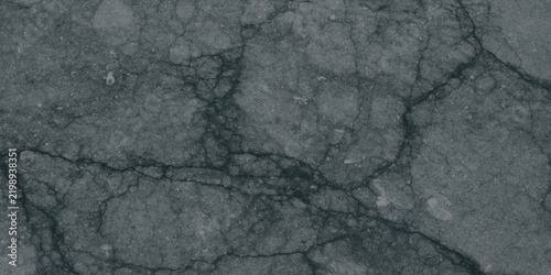 Dark grey cracked asphalt texture with deep cracks and rough surface details, 84 characters