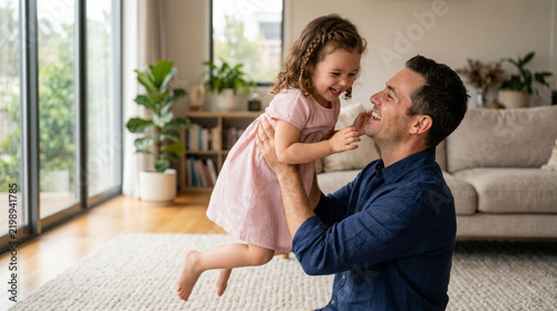 Father Lifting Happy Daughter Indoors, Family Bonding, Joyful Childhood