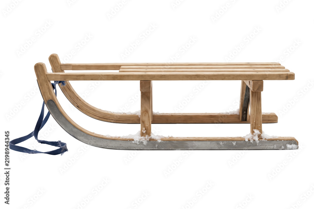 Obraz premium Classic wooden sled isolated on a transparent or white background. Essential winter outdoor game equipment, children snow riding gear and active holiday sport.