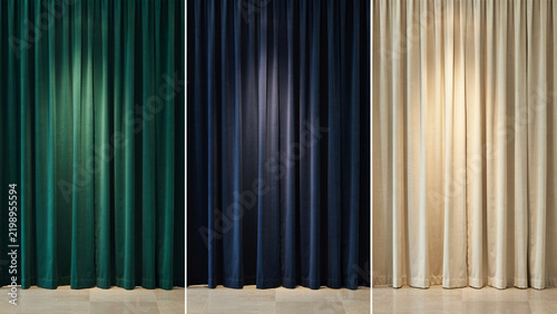Three sets of hanging curtains in green, dark blue, and cream colors with soft lighting
