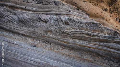 Close-up of layered sedimentary rocks showing texture and erosion patterns. Apo Island, Philippines