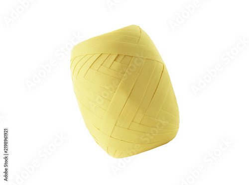 Картината върху платно Yellow paper raffia ribbon roll spool for festive gift wrapping.