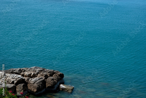 Coastal view with rocks and sea background.