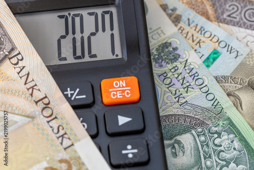 Polish currency in 2027 year. Financial business concept. Money and calculator with date 2027. Market analysis In Poland.  exchange rate. Economic background. closeup