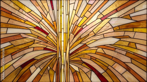 A stained glass panel depicts an abstract tree form with golden and amber hues stainedglass glasswork vitreous foliage