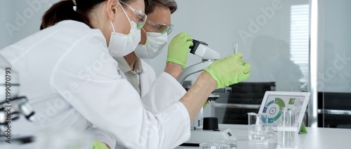Konstfotografi Two scientists collaborating in a modern laboratory