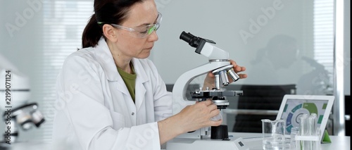 Fotografie Female scientist working in a modern research laboratory, diligently examining s