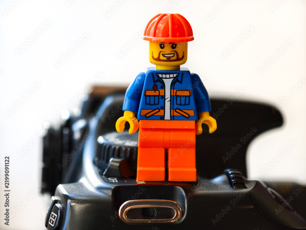 Obraz premium Russia, St. Petersburg, August 8, 2020 A lego man standing on top of a camera, perfect for photography or creative projects