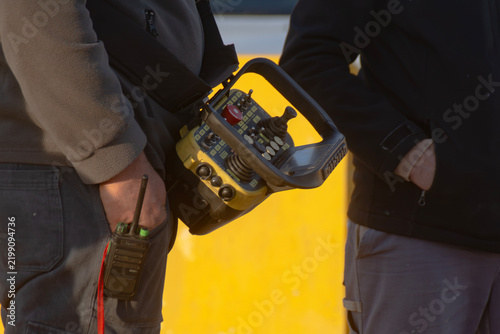 Fotografie close-up of portable industrial radio remote control used for safely operating h