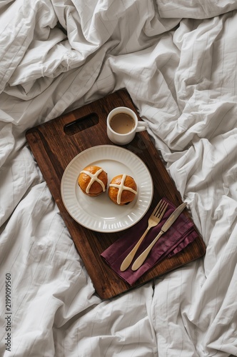 Breakfast Tray With Sweet Rolls and Coffee on a Bed