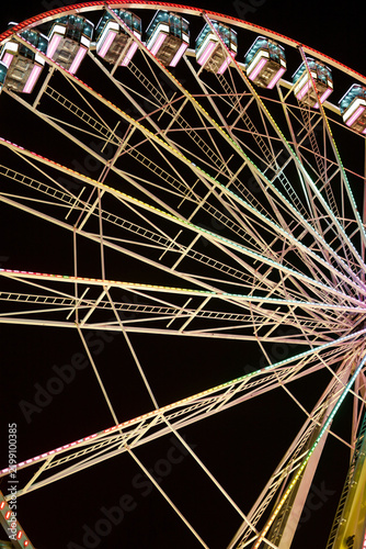 Colorful Geometric Light Patterns of a Ferris Wheel Structure at Night