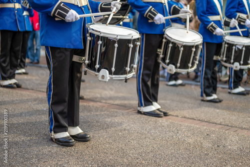  Marching Band Drummers in Blue Uniform Performing in a Street Parade