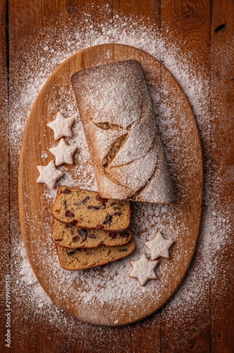 Baked Goods on a Wooden Board With Powdered Sugar at a Kitchen
