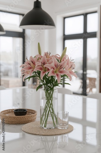 Beautiful Lily Flowers in a Glass Vase on the Kitchen Counter