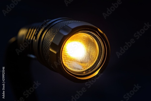 Glowing headlamp with adjustable strap shines brightly in darkness