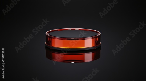 Robotic vacuum cleaner with glossy orange finish on black background