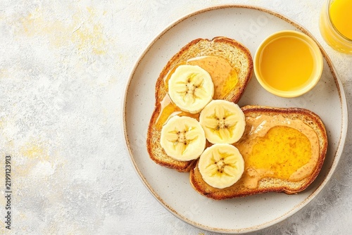Toast with peanut butter and banana slices ready to eat
