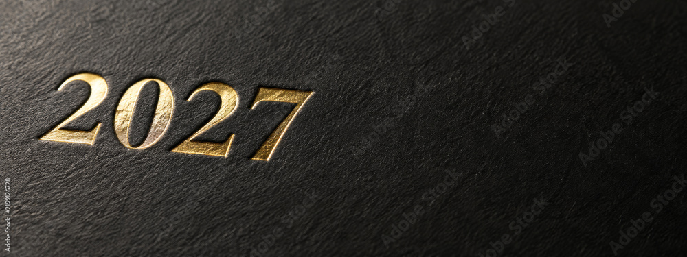 Fototapeta premium 2027 gold foil numbers embossed on black leather texture, minimal new year 2027 black gold background with copy space, elegant 2027 leather cover design, wide banner with luxury gold foil digits