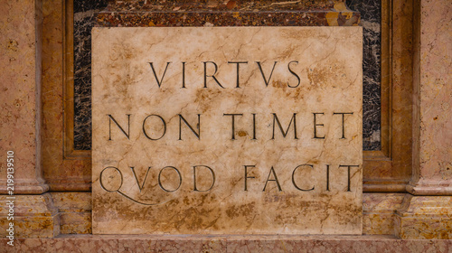 Latin motto Virtus Non Timet Quod Facit carved in stone