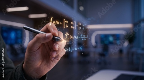 Close up of student hand using digital stylus creating glowing floating math equations