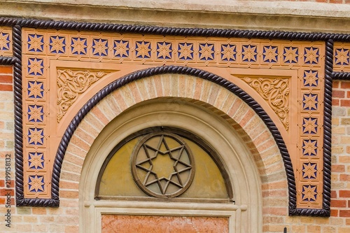 This ornate brick arch decorates the facade of the Cetate Synagogue in Timisoara, Romania.