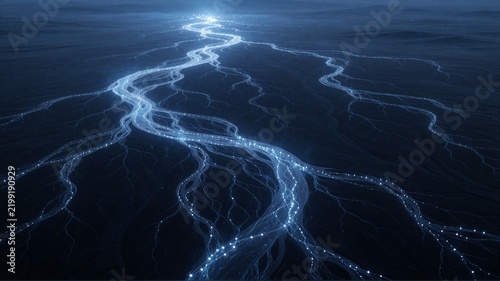 Aerial view of glowing blue river delta at night