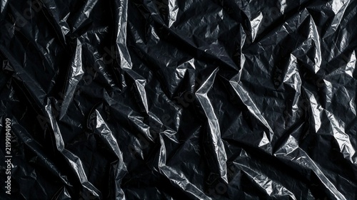 Crumpled Black Plastic Texture Background