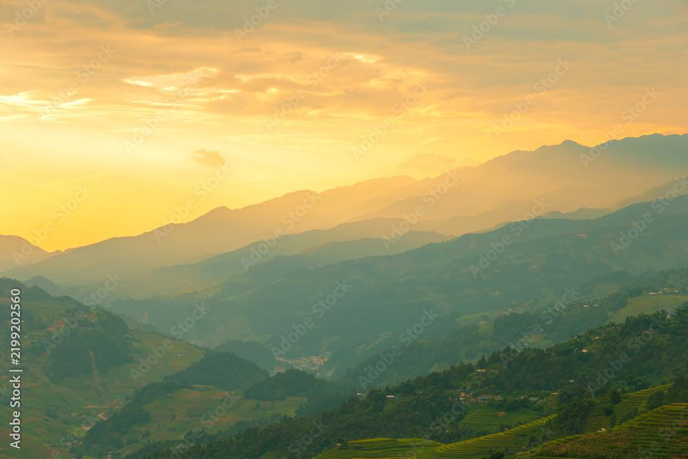 Fototapeta premium Beautiful sunset in the mountains. The Mu Cang Chai rice terraces in Vietnam.