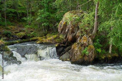 Waterfall in the forest in Lapland Finland
