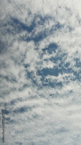 White Cirrocumulus Clouds Scattered Across Blue Sky