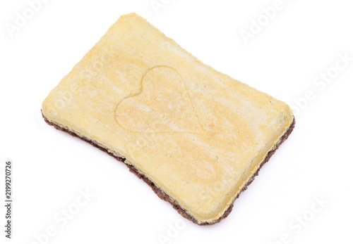Chocolate filled biscuit cookie with heart engraved isolated on white background