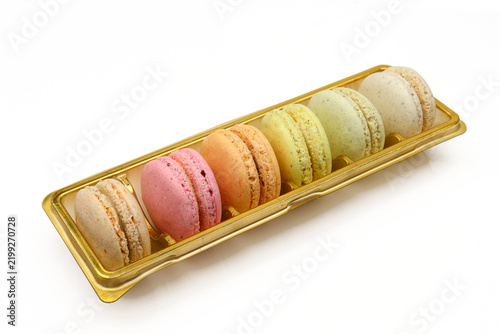 Set of different color macaroons isolated on white background. French dessert delicacy