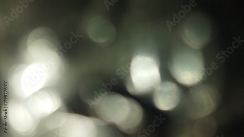 Abstract Blurry Silver Bokeh Lights Defocused Glimmer Texture Background
