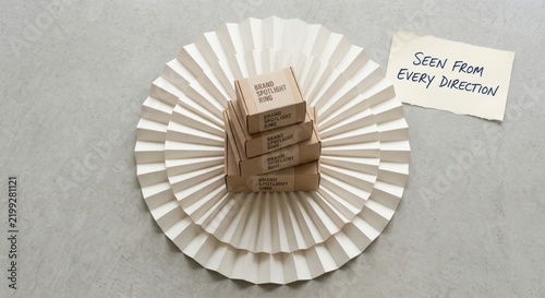 Stack of Small Cardboard Boxes on Pleated Paper Fan