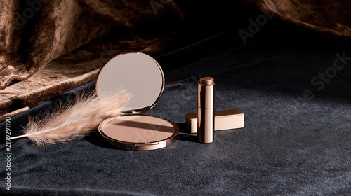Cosmetic Compact Lipstick and Feather in Warm Light