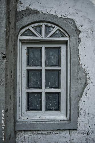 Old wooden windows in a rustic wall