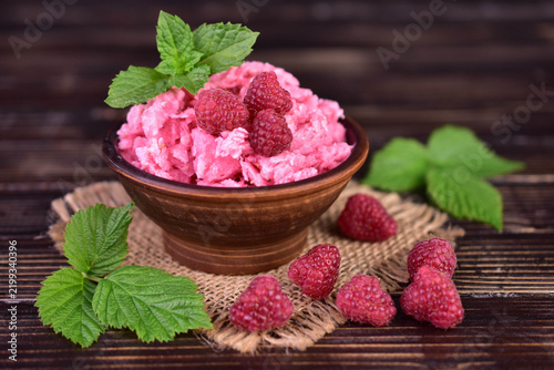 Summer raspberry sorbet with fresh raspberries; selective focus image.

